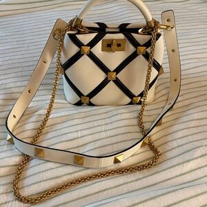 Valentino Garavani Stylish Black and White Handbag with Gold Accents